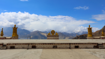 Himalayas over a temple in Tibet