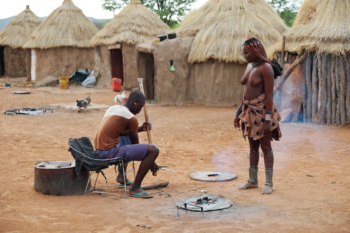 Himba girl at the local blacksmith