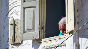 aged indian woman in the window