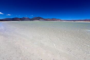 alpine beach with crystal water