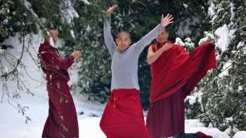 monks playing in snow