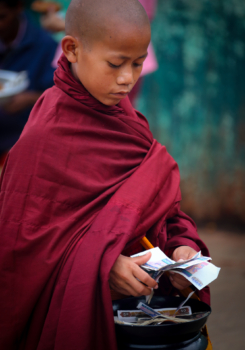 young monk with money, Myanmar