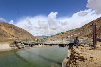 suspension bridge over a mountain river in the Himalayas